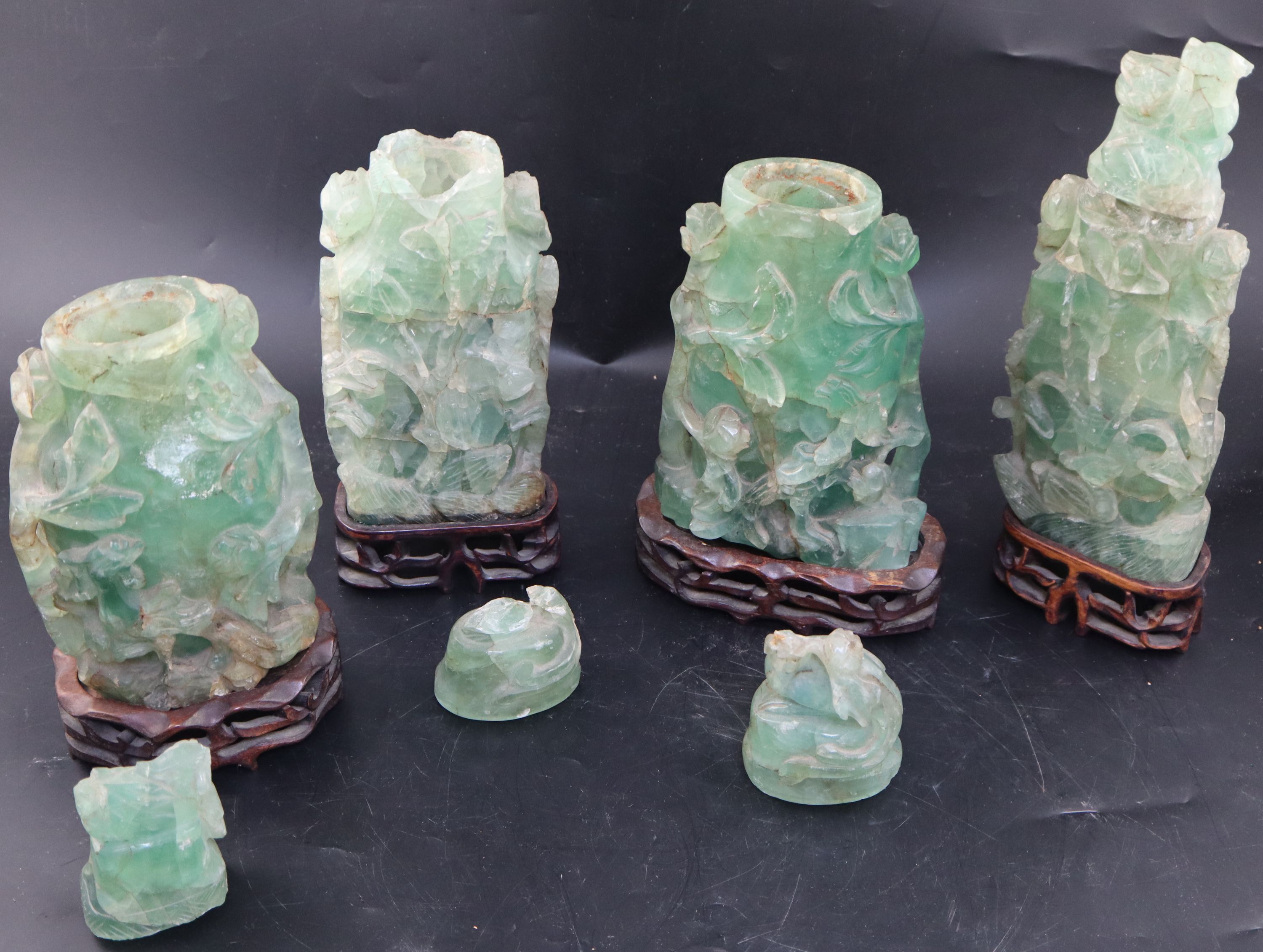 Four late 19th / early 20th century Chinese green quartz vases and covers, largest 27.5cm